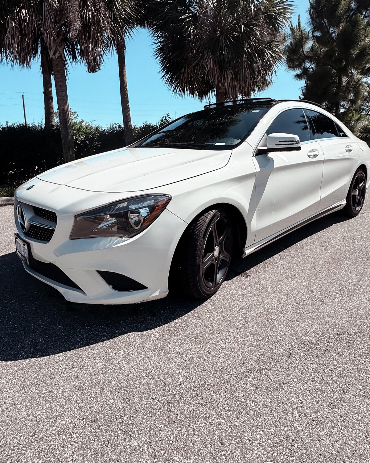 White Mercedes-Benz CLA coupé saloon