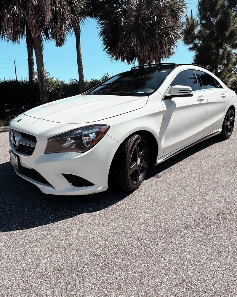 White Mercedes-Benz CLA coupé saloon